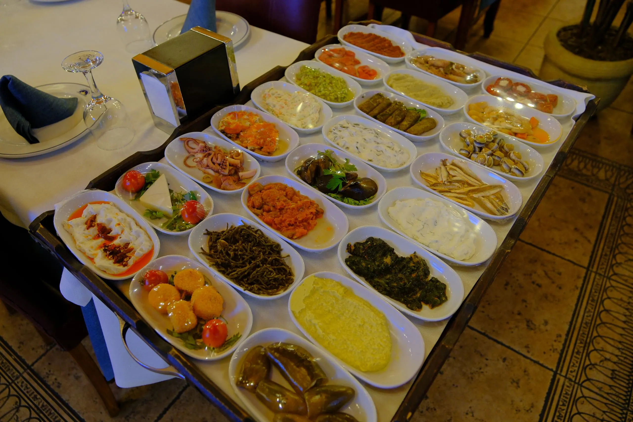 A tray of cold meze presented at the table