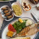 A guest’s table: grilled fish, stuffed mussels, fava and meze